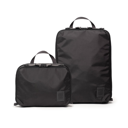 Front white background image of Topo Designs Global Compression Pack Bag Set in "Black / Black"