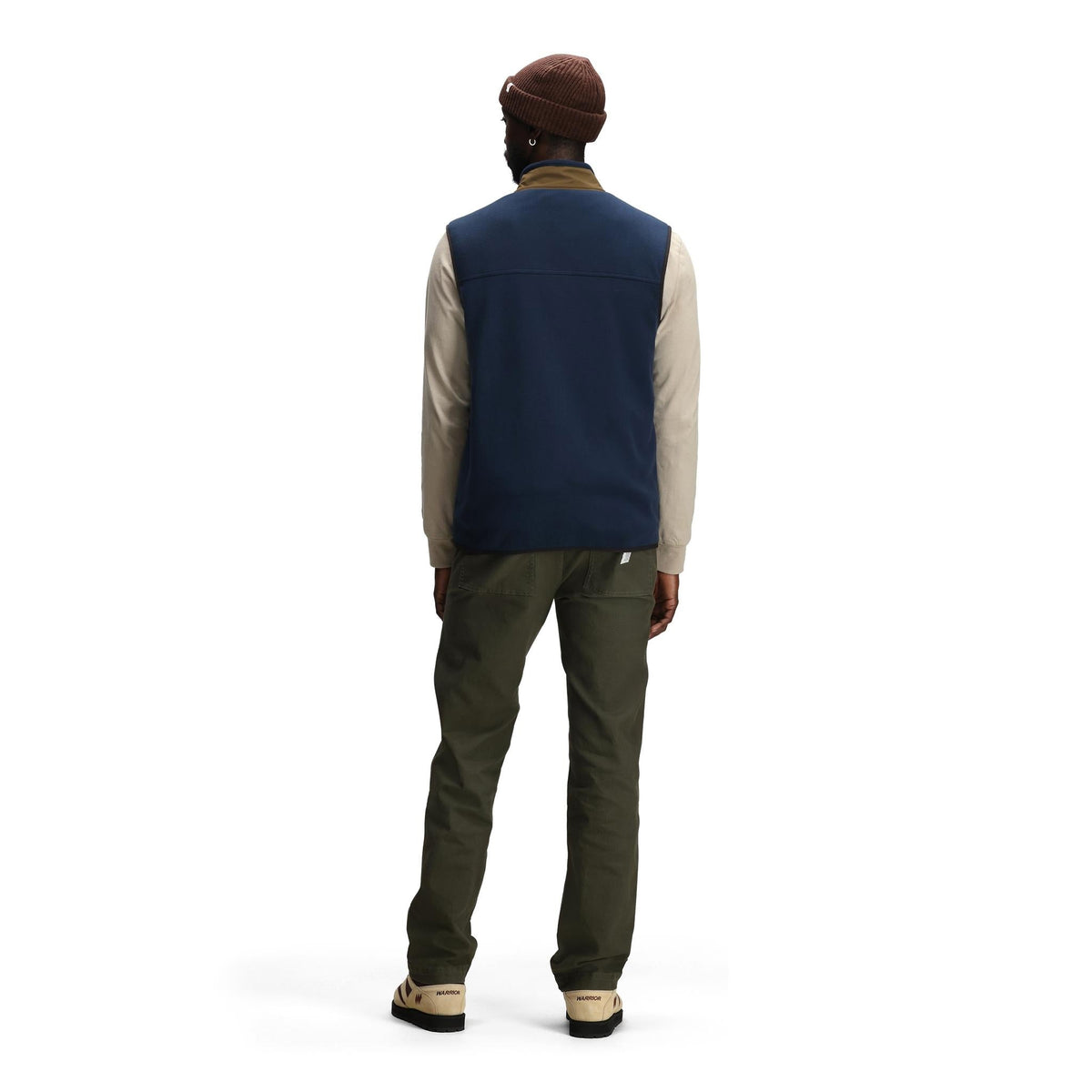 General back model shot of Topo Designs Vista Lightweight Fleece Vest - Men's in "Midnight / Desert Palm"