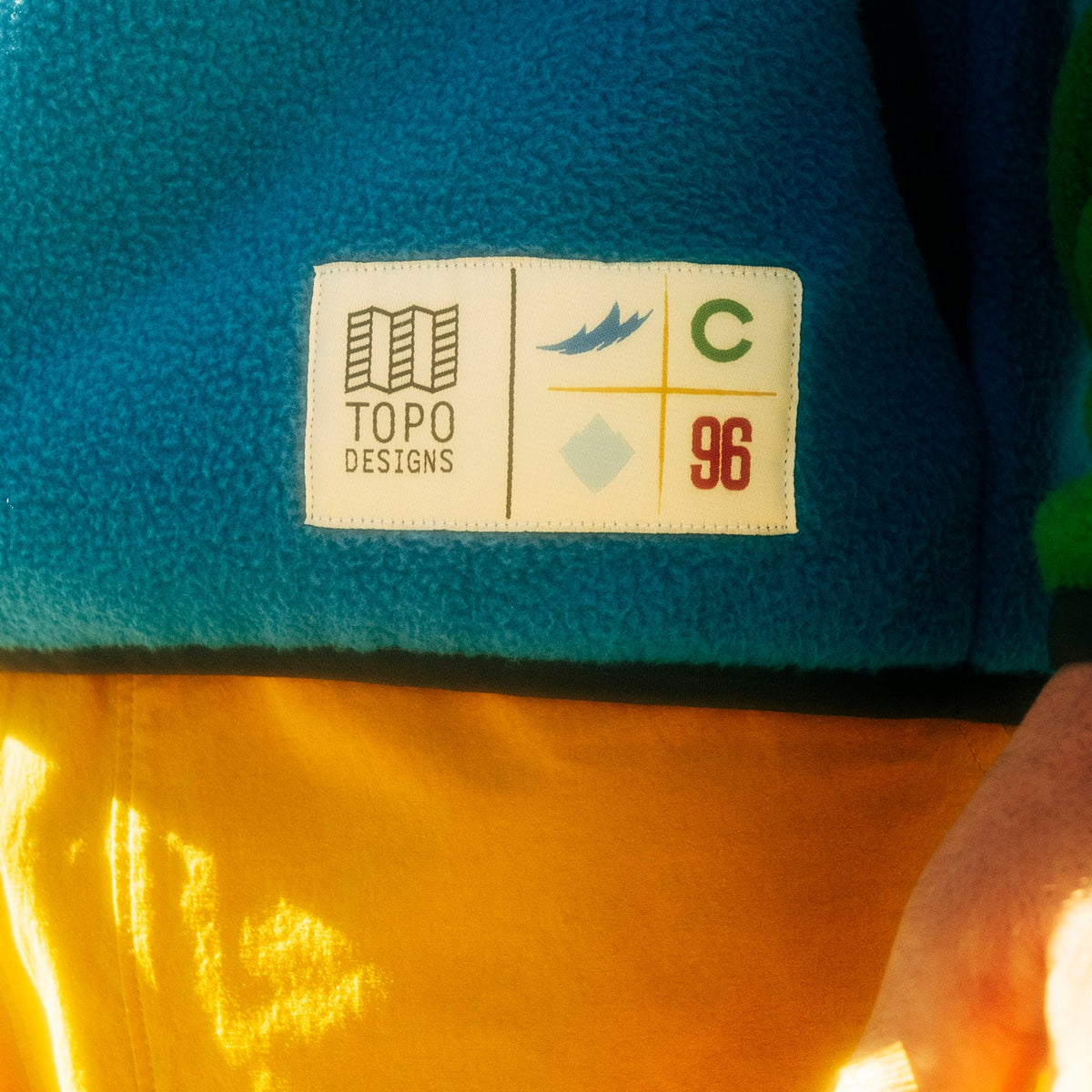 General lifestyle shot of Topo Designs x Colorado Rapids Vista 1/4 Zip Fleece